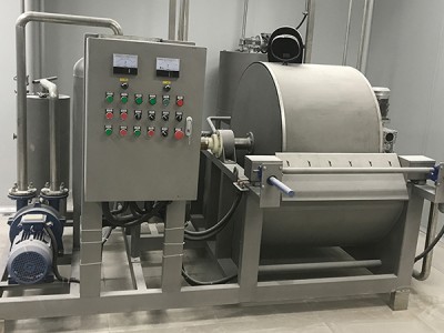 What is the purpose of a rotary drum filter?